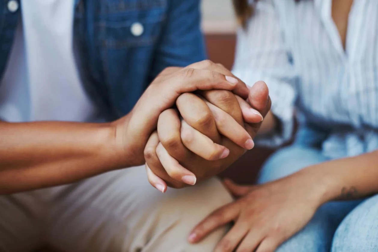 mixed race couple consoling each other